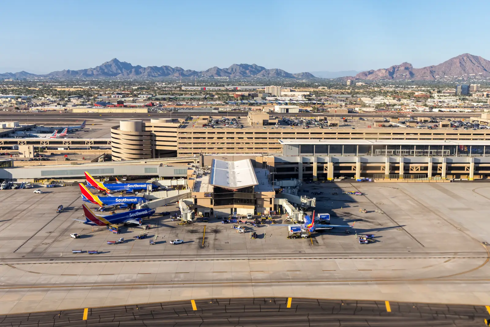 Avolta Secures Eight-Year Travel Retail Extension At Phoenix Airport 3 Aerial view of Southwest Airlines Boeing 737 aircraft parked at Phoenix Sky Harbor International Airport with desert mountains in the background