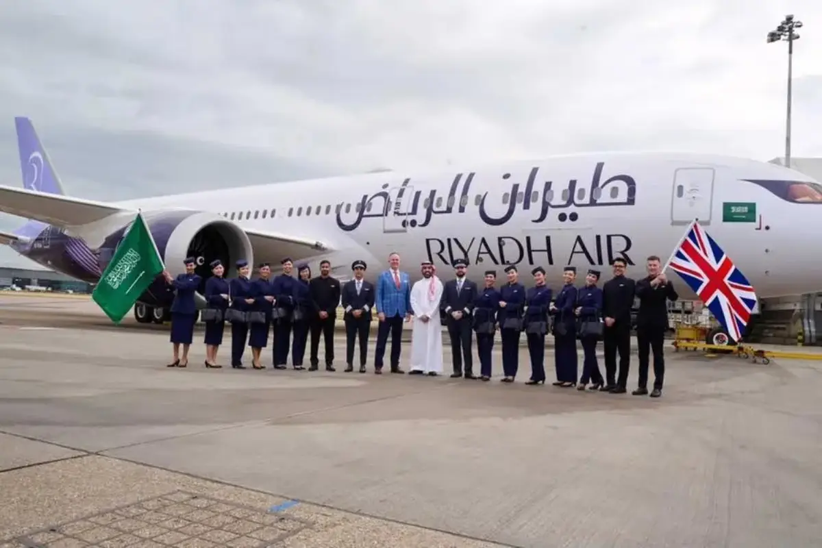 Riyadh Air’s First Commercial Flight Brought Forward By 3 Weeks, Tickets On Sale For 5 New Destinations 4 Riyadh Air crew members standing in front of a Boeing 787 Dreamliner during the airline’s London launch event