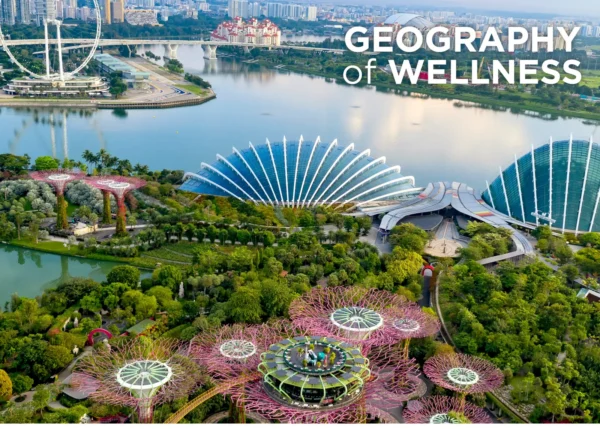 Aerial view of Singapore's Gardens by the Bay, Marina Bay and the Singapore Flyer highlighting the city's integration of green spaces and urban wellness.