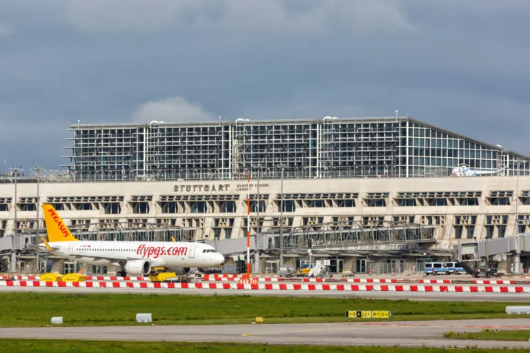 Transportation 7 Pegasus Airlines aircraft parked on the apron in front of Stuttgart Airport terminal in Germany.