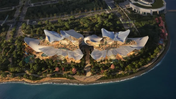 Aerial rendering of Therme Singapore at Marina South, showcasing the future integrated wellbeing destination with organic architecture, pools, gardens and waterfront surroundings.