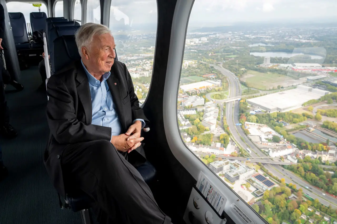 Viking Announces Zeppelin Airship Rides And New Offerings For European River Voyages 3 Viking Executive Chairman Torstein Hagen looking out a Zeppelin window at aerial views over Cologne and the Ruhr Valley