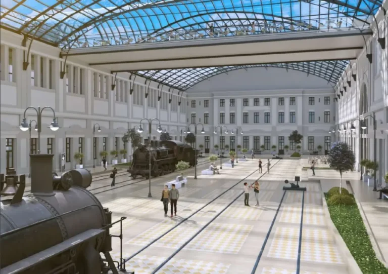 Architectural render of the restored Trieste Campo Marzio station museum interior with historic steam locomotives under a steel and glass roof