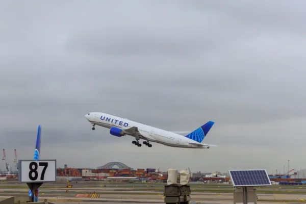 United Airlines passenger aircraft taking off from Newark Liberty International Airport under cloudy skies
