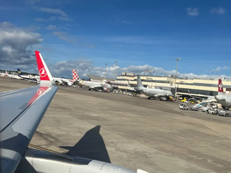 Multiple aircraft including Turkish Airlines, Volotea and Swiss on the apron at Valencia Airport terminal