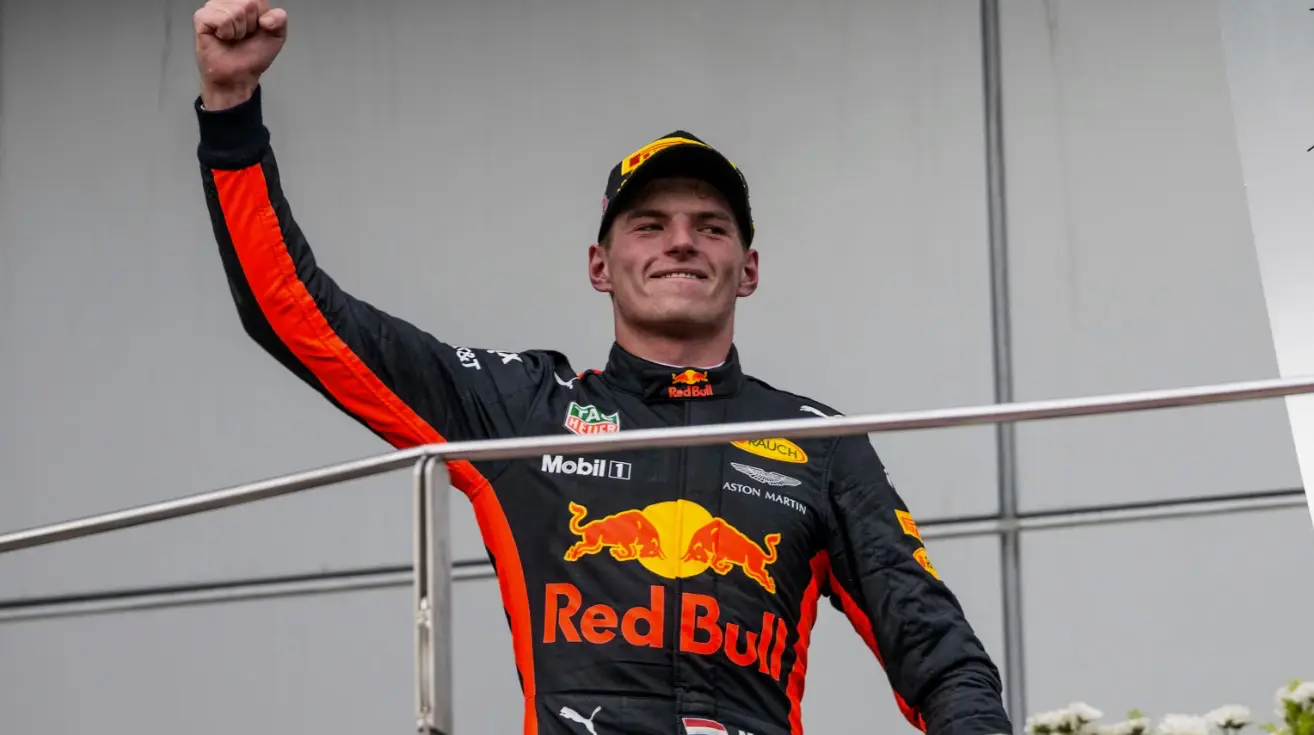 Max Verstappen celebrates on the podium after winning the Formula 1 Malaysian Grand Prix at Sepang