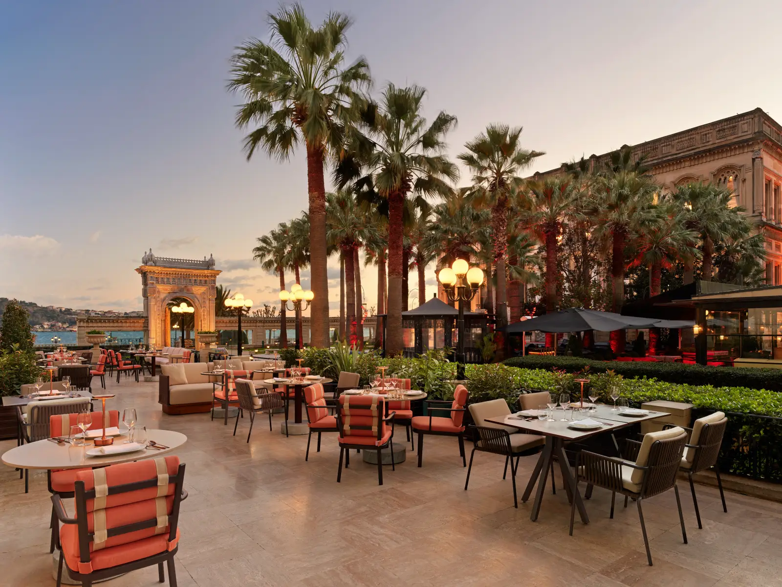 Rüya Istanbul Launches New Summer Menu At Çırağan Palace 6 Outdoor terrace dining at Rüya Istanbul at Çırağan Palace Kempinski overlooking the Bosphorus at sunset.