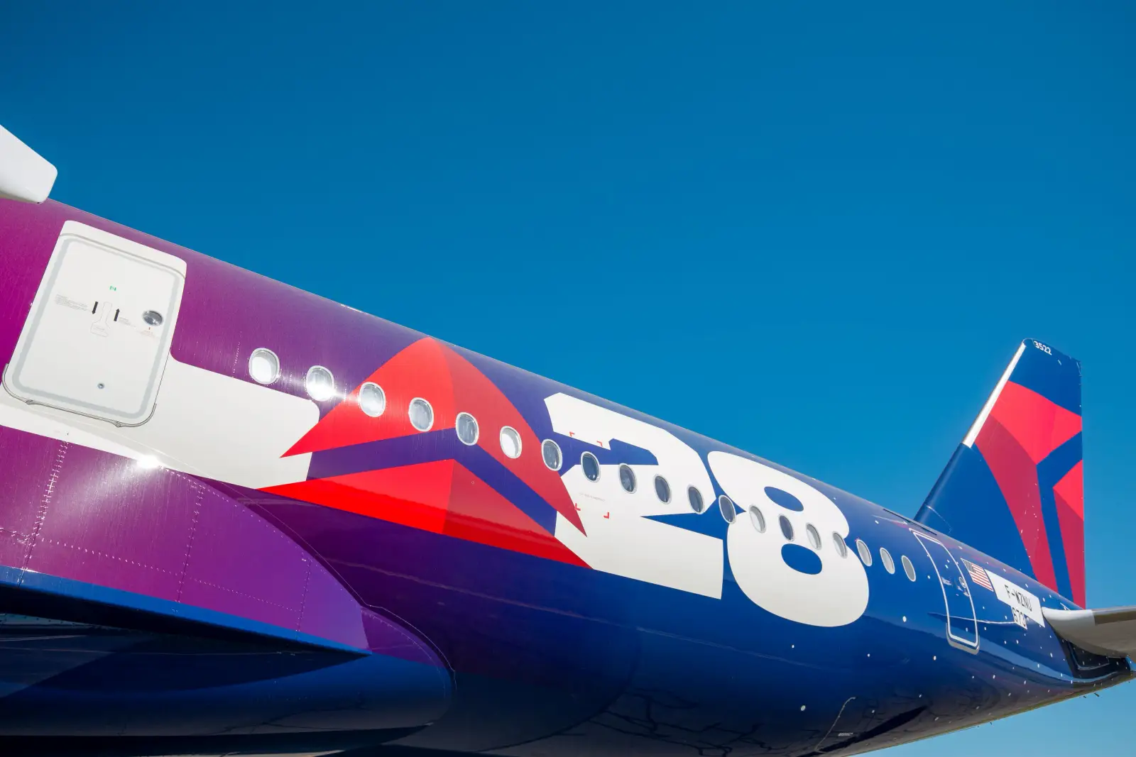 Delta To Launch Nonstop Flights Between Los Angeles And Manila In March 2027 3 Delta Air Lines Airbus A350-900 in LA28 special livery parked on the airport apron.