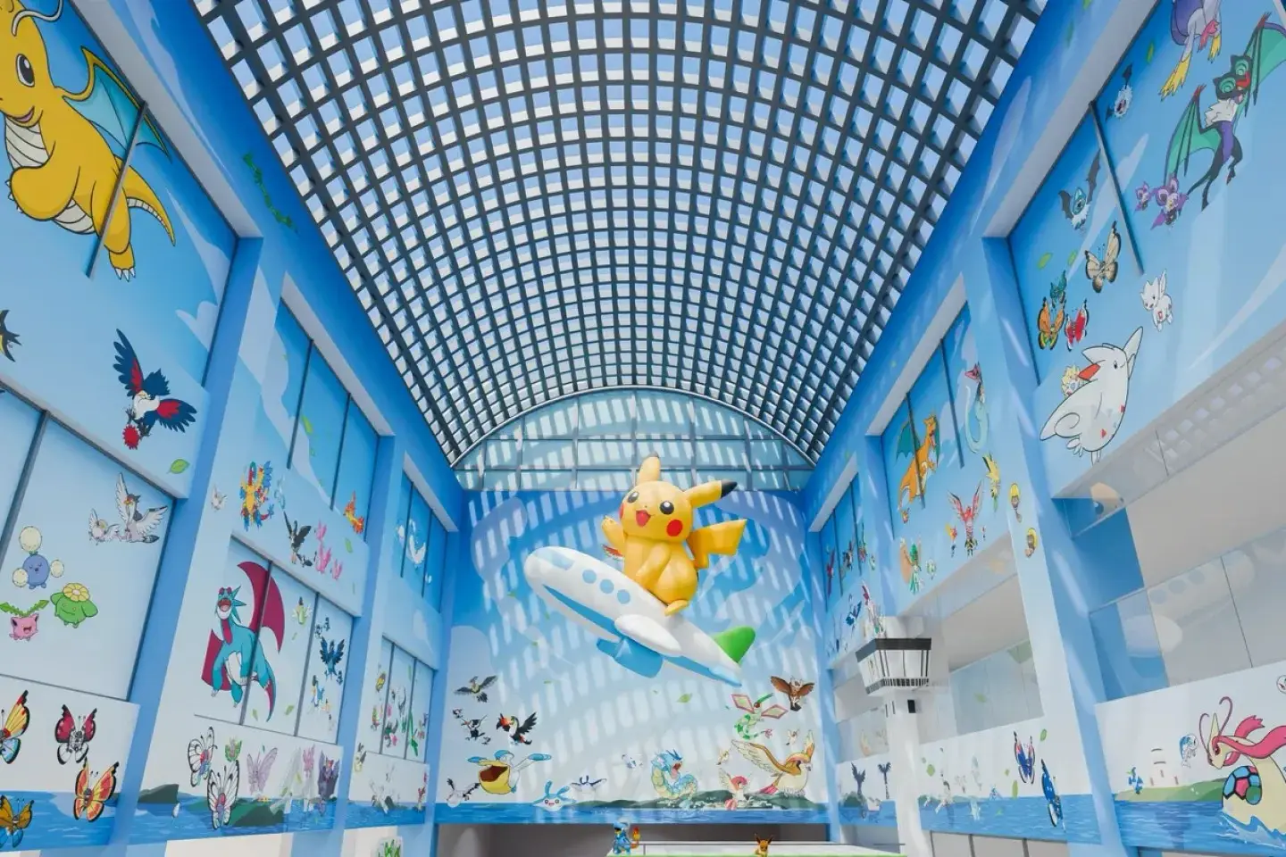 Pikachu balloon suspended above an airplane inside the Pokémon-themed atrium at Noto Satoyama Airport in Ishikawa, Japan.