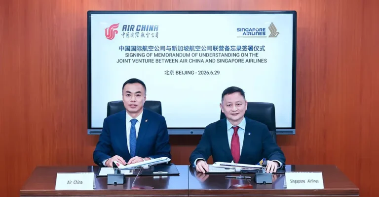 Air China and Singapore Airlines executives sign a memorandum of understanding for a commercial joint venture partnership in Beijing.