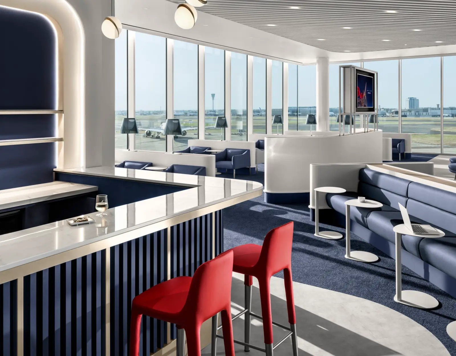 Interior of the new Air France lounge at London Heathrow Terminal 4 featuring runway views, premium seating and a stylish bar area.