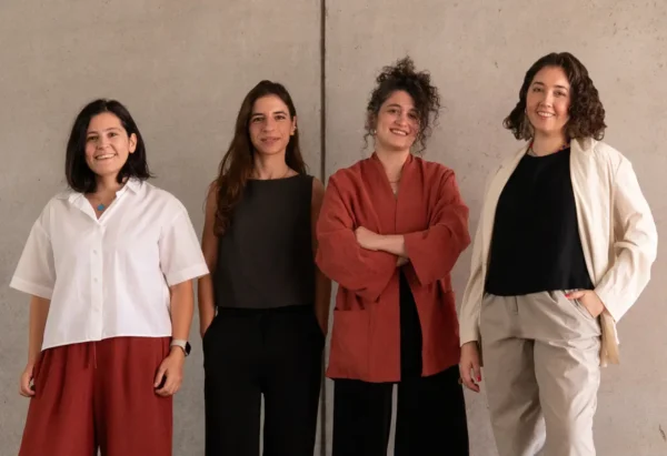 Home 2 The four members of ba-be commons standing together against a concrete wall