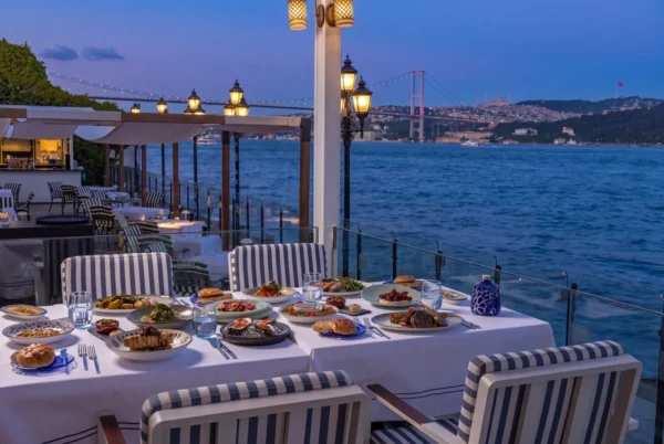 Dinner table at Bosphorus Grill overlooking the Bosphorus Bridge at dusk.