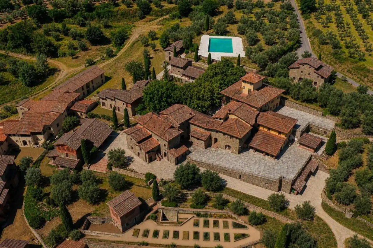 Chapter Chianti Opens In Tuscany With 82 Rooms And Suites 3 An aerial view of Chapter Chianti, a luxury hotel set within a restored stone village in the Chianti hills of Tuscany.