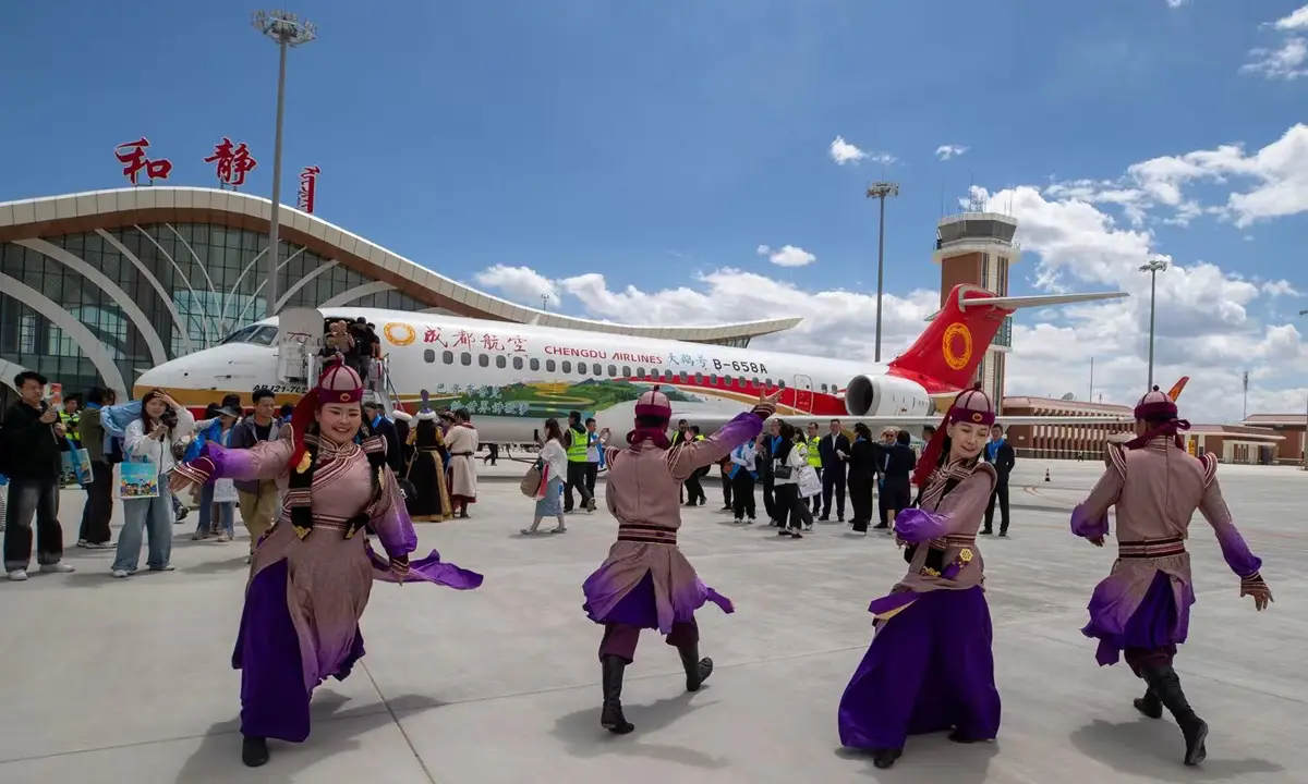 Flight Routes From China To Central Asia, Latin American Up By 70% In H1 2026 3 Traditional dancers welcome the inaugural Chengdu Airlines flight after landing at an airport in Central Asia.