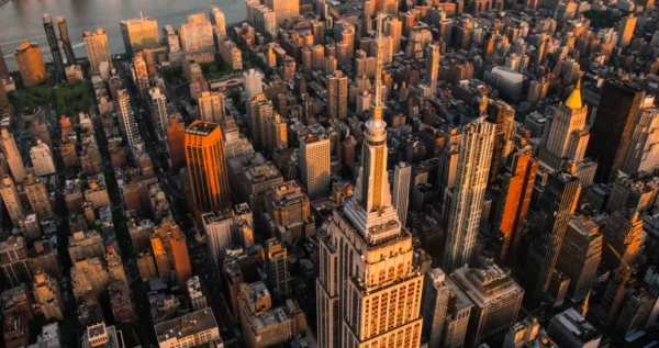 Home 12 Aerial view of the Empire State Building and Manhattan skyline at sunset