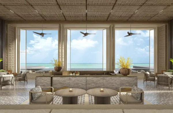 Home 14 Lobby lounge at Hilton Burau Bay Langkawi Resort overlooking the Andaman Sea through floor-to-ceiling windows with contemporary tropical design.