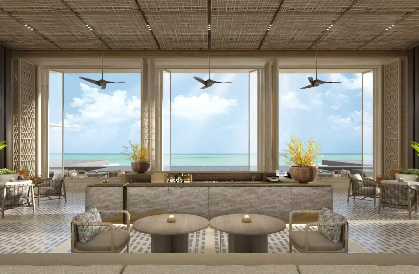 Lobby lounge at Hilton Burau Bay Langkawi Resort overlooking the Andaman Sea through floor-to-ceiling windows with contemporary tropical design.