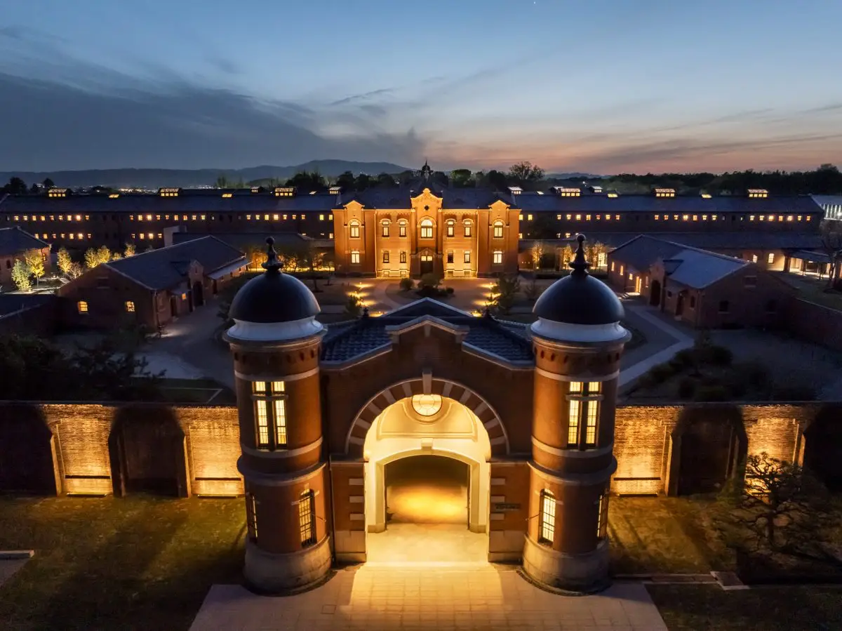 Hoshinoya Nara Prison Opens As Luxury Hotel In Historic Landmark 6 Aerial twilight view of HOSHINOYA Nara Prison, a restored Meiji-era prison transformed into a luxury heritage hotel in Nara, Japan.