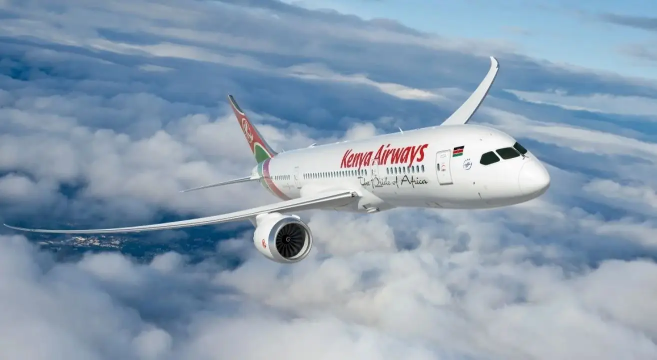 Kenya Airways Deploys Boeing 777-300Er Aircraft On London Route 3 Kenya Airways Boeing 777-300ER flies above the clouds, highlighting the airline's long-haul fleet serving international routes from Nairobi.