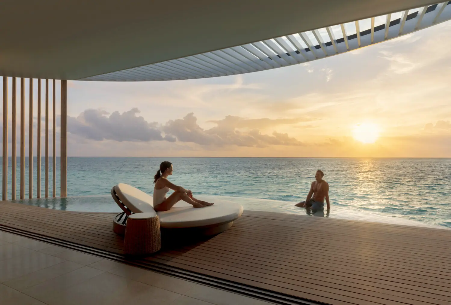 Beyond The Gen Z Myth: Four Distinct Luxury Mindsets Reshaping Travel In Asia Pacific 5 Couple relaxes beside a private infinity pool overlooking the ocean, illustrating the Quiet Luxurist travel mindset focused on privacy, seclusion and digital disconnection.