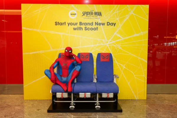 Spider-Man themed photo installation with Scoot aircraft seats at Singapore Changi Airport Terminal 1 promoting Spider-Man: Brand New Day flights.