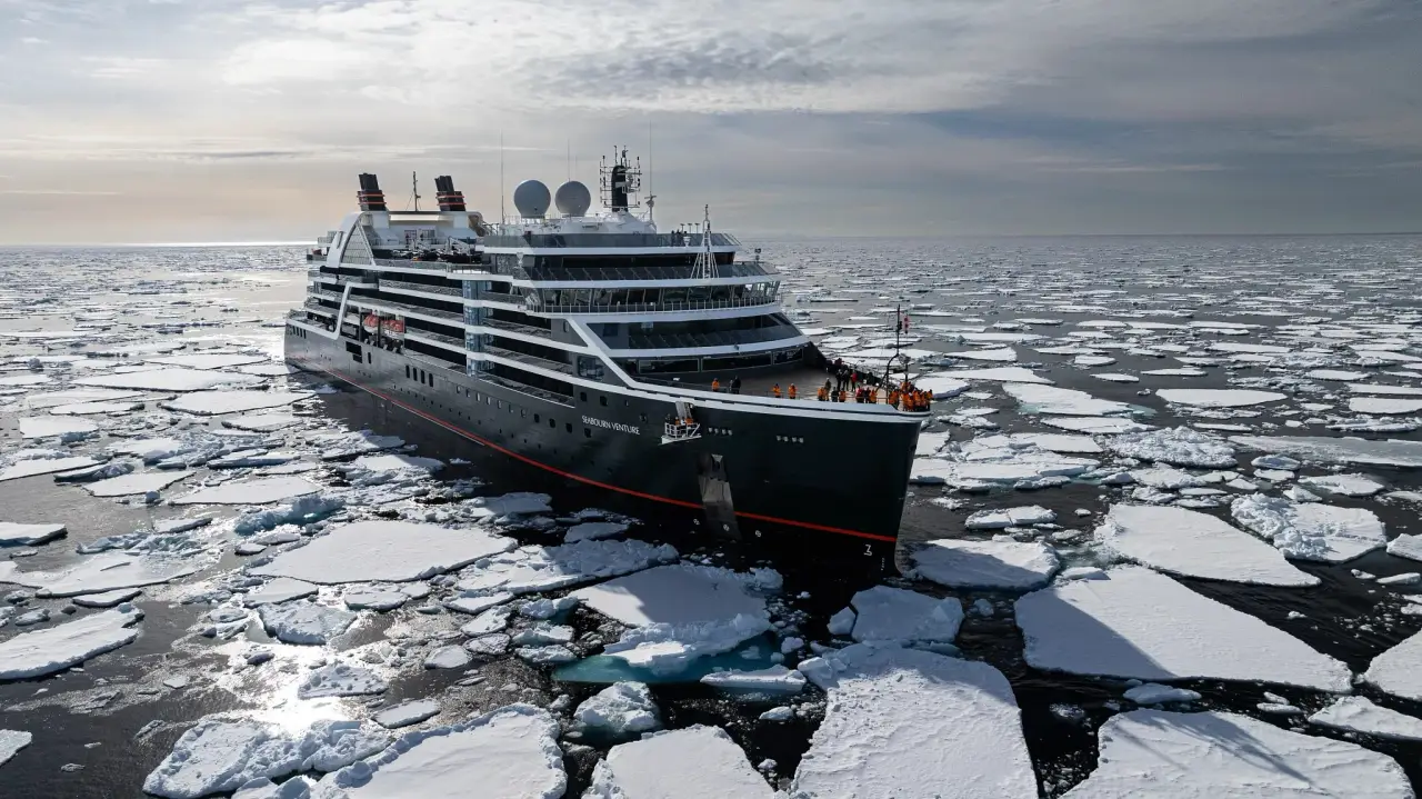Seabourn Celebrates The Line’s 40Th Anniversary With 54 Special Voyages In 2028 3 Seabourn Venture navigates through sea ice during an Arctic expedition cruise, surrounded by floating ice floes in polar waters.