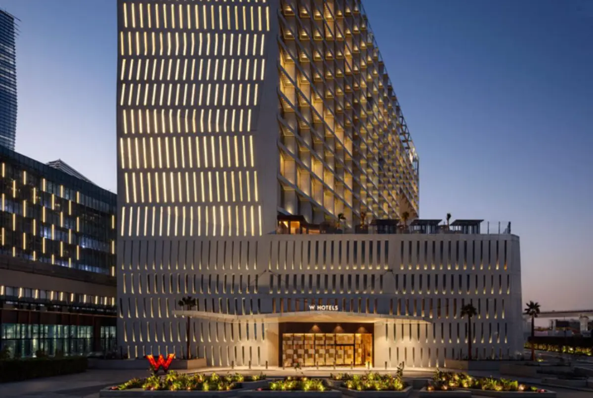 Exterior view of W Riyadh KAFD hotel in King Abdullah Financial District illuminated at dusk.